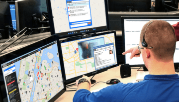 emergency dispatch coordinator sitting at computer terminal