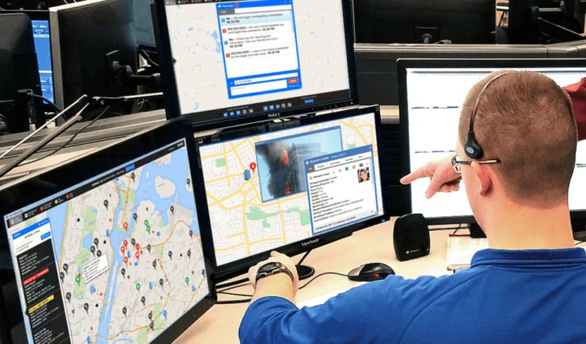 emergency dispatch coordinator sitting at computer terminal