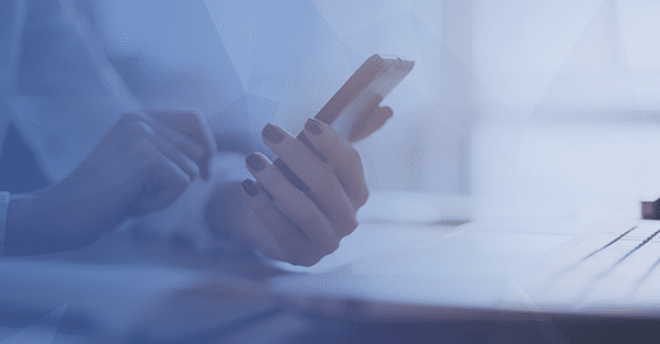 business-woman-using-phone-blue-prism-overlay-banner-thumbnail person texting on phone