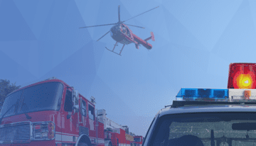 helicopter flying above a police car