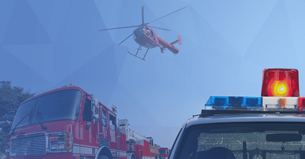 helicopter flying above a police car