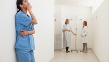 Nurses in hallway stock