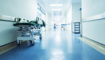 hospital corridor with bed in hallway