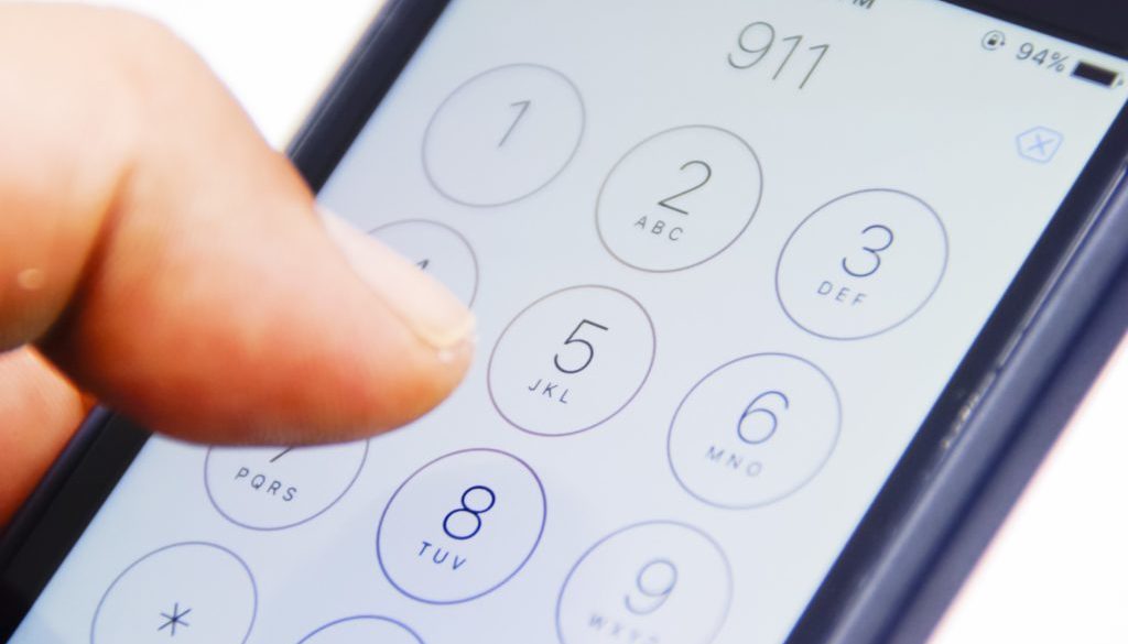 911-call-phone-typing-stock-image