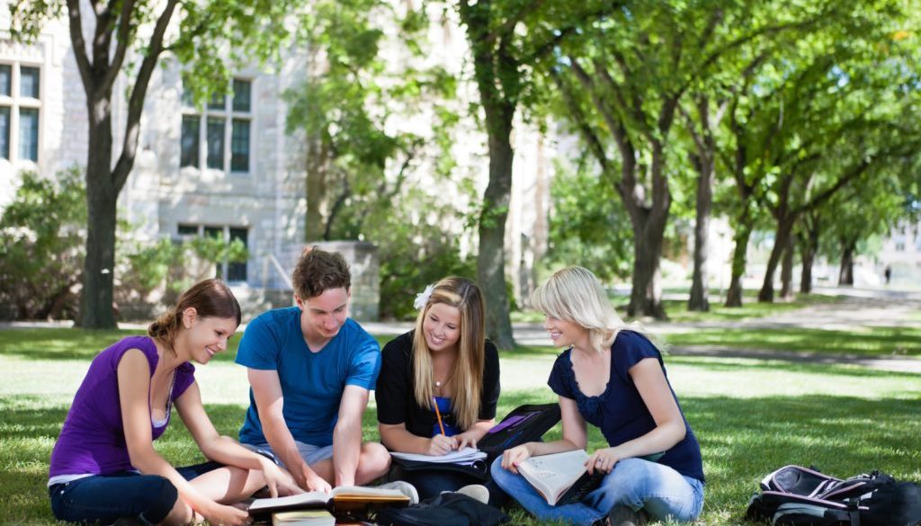 college-students-studying-outside-campus-stock-image