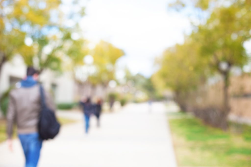 blurred college students walking