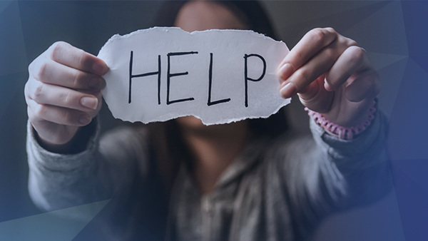 domestic violence woman holding help sign