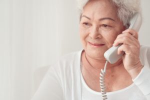 elderly woman talking on the phone