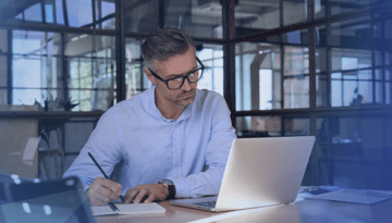 man working looking at laptop computer