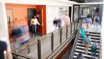 Busy High School Corridor During Recess With Blurred Students