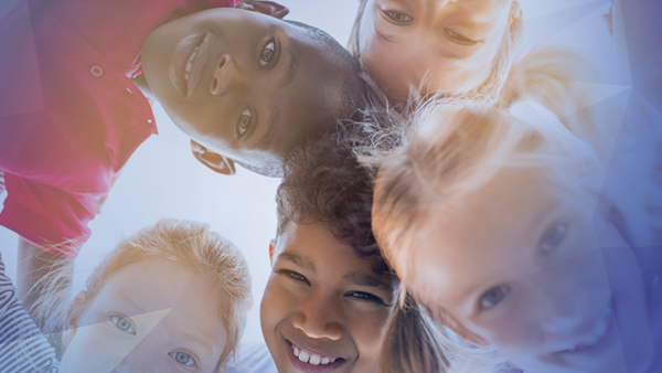 middle school students grouped together smiling