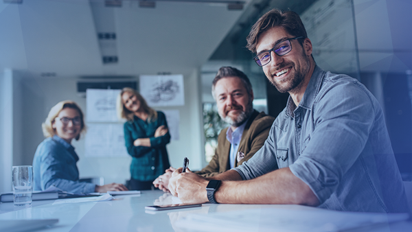 office employees smiling siting together