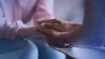 person holding hand mental health support