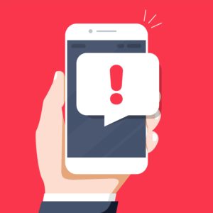 cartoon hand holding phone with alert