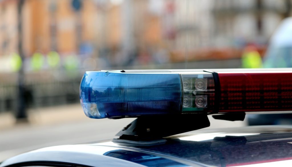 police car on patrol during the day