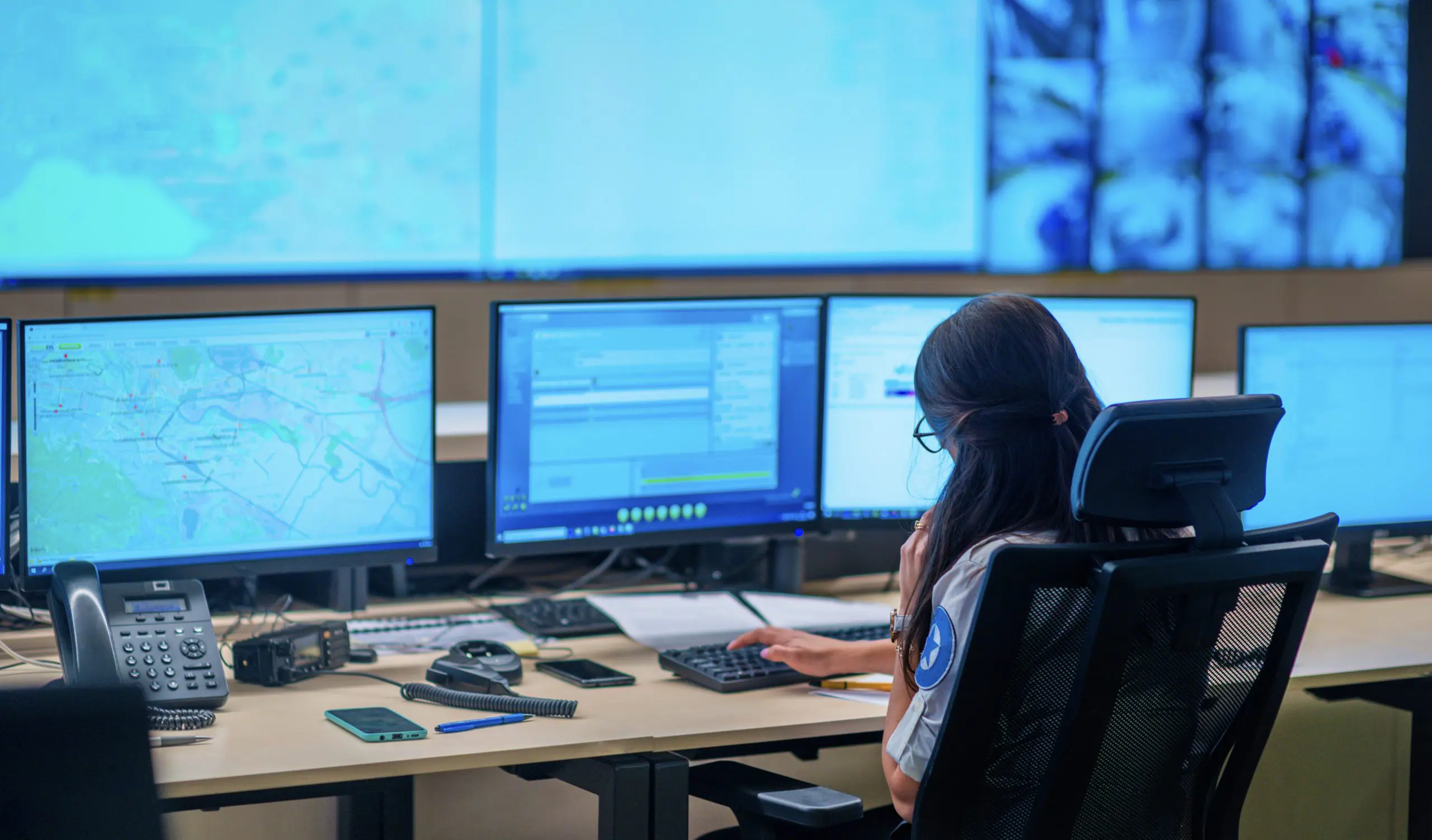 dispatcher sitting in front of computer screens
