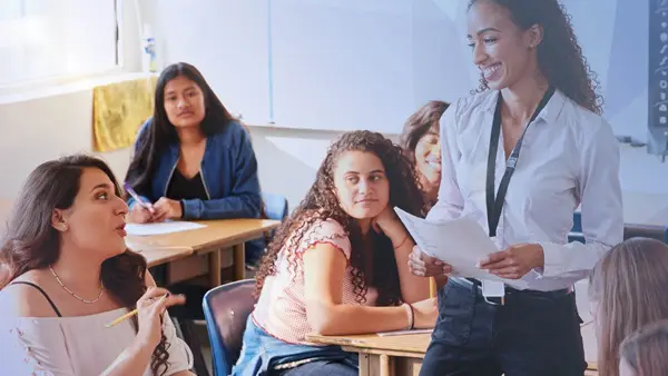 student and teachers in classroom