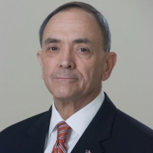 William Clift headshot of him in a suit with a tie