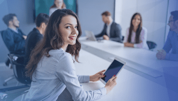 corporate employee woman working on tablet in meeting