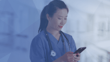 nurse in scrubs texting on cellphone