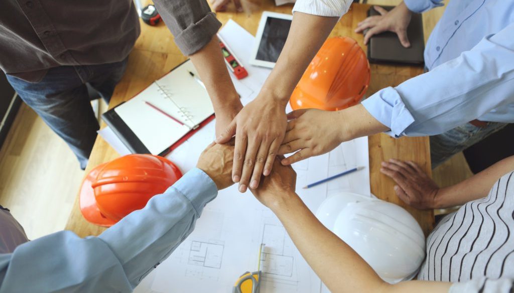 coworkers uniting their hands