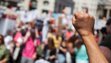 fist in the air during a social unrest march
