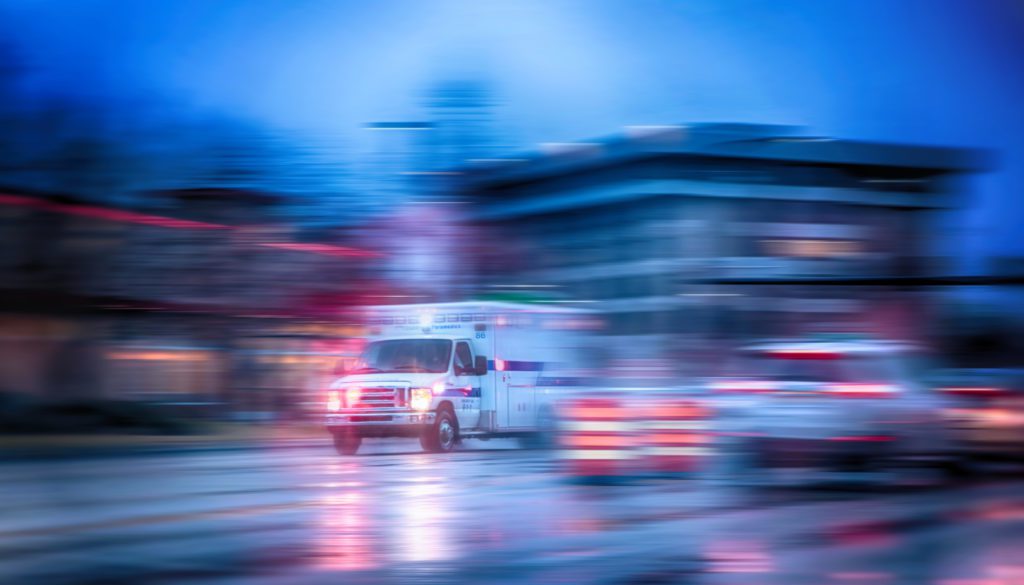 ambulance driving with lights on