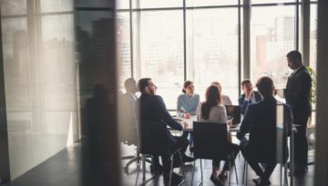 employees sitting at a conference table