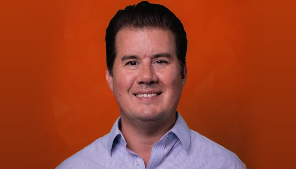 man smiling in a collared shirt