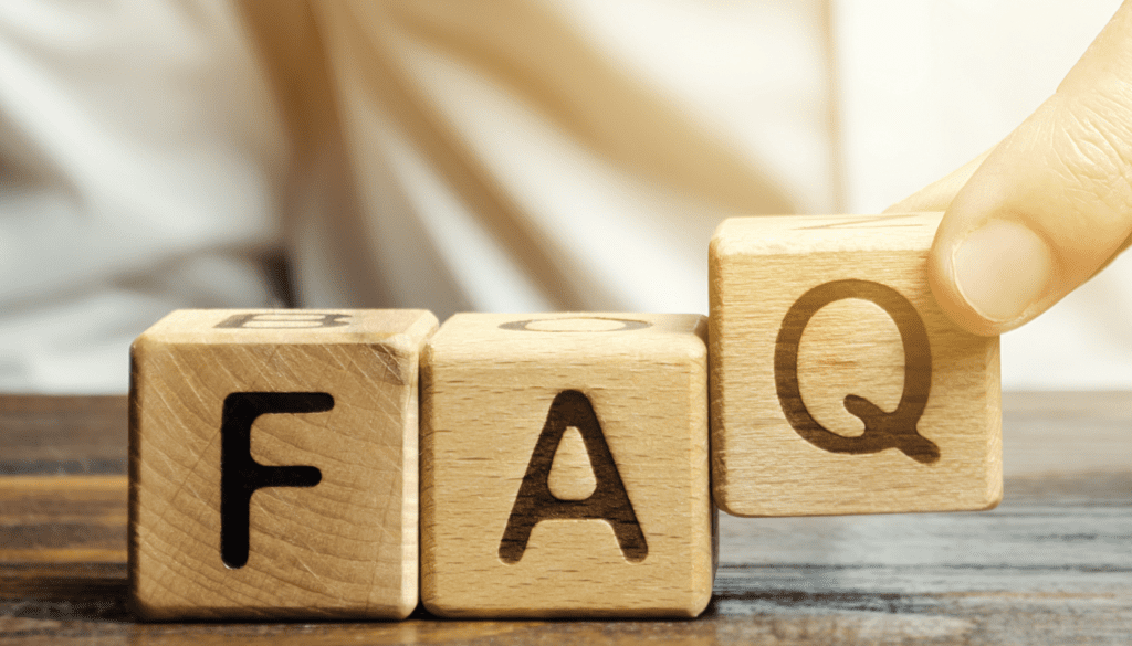 hands placing scrabble squares that spell "FAQ"