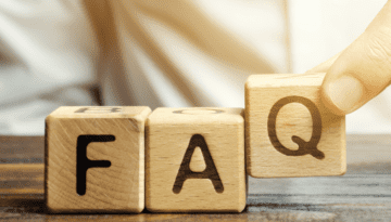 hands placing scrabble squares that spell "FAQ"