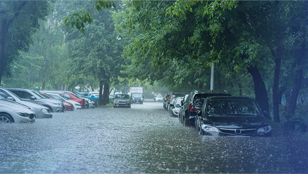 flooded road with cars on it