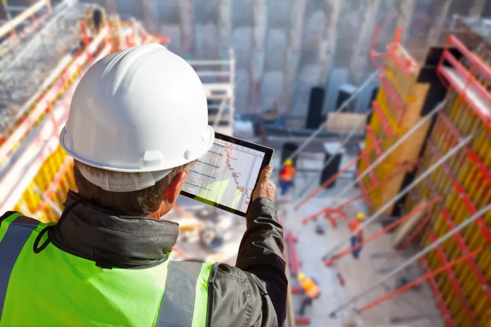 construction-worker-holding-tablet-plans