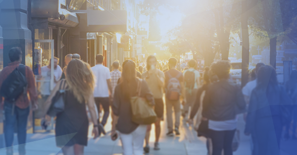 crowd walking down city street