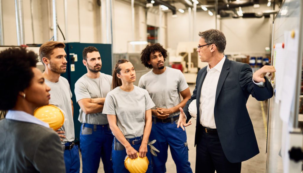 employees in a group at a safety meeting