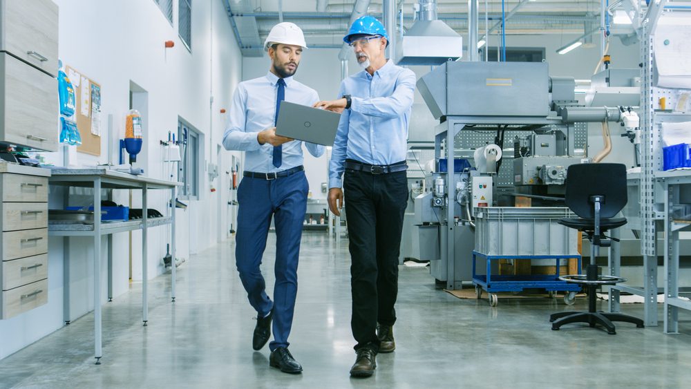 manufacturing facility coworkers walking together