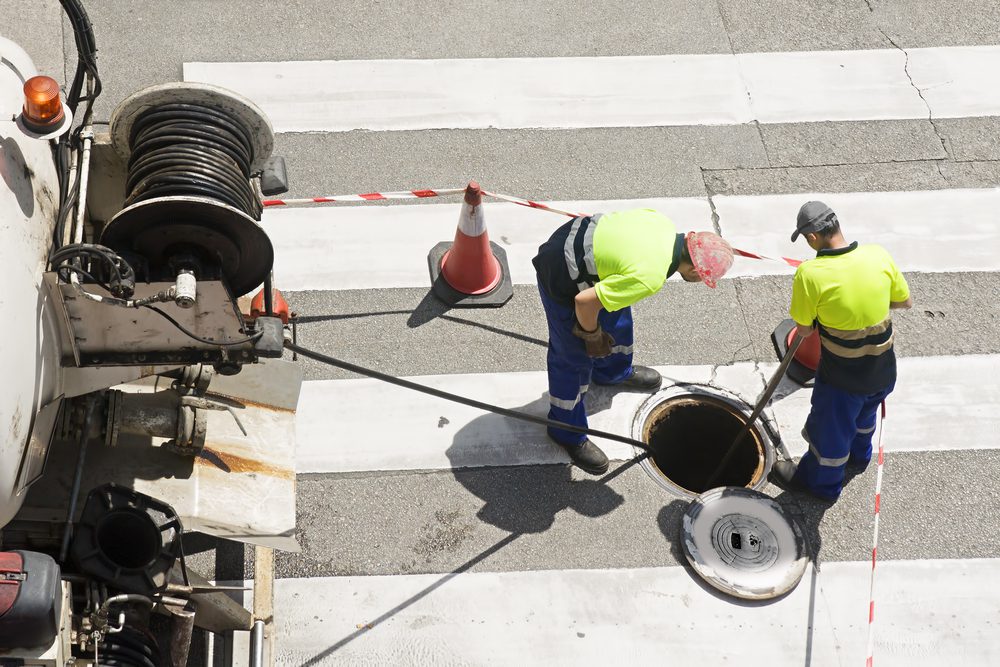 utility-workers-manhole-cover