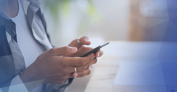 woman holding phone reading notification