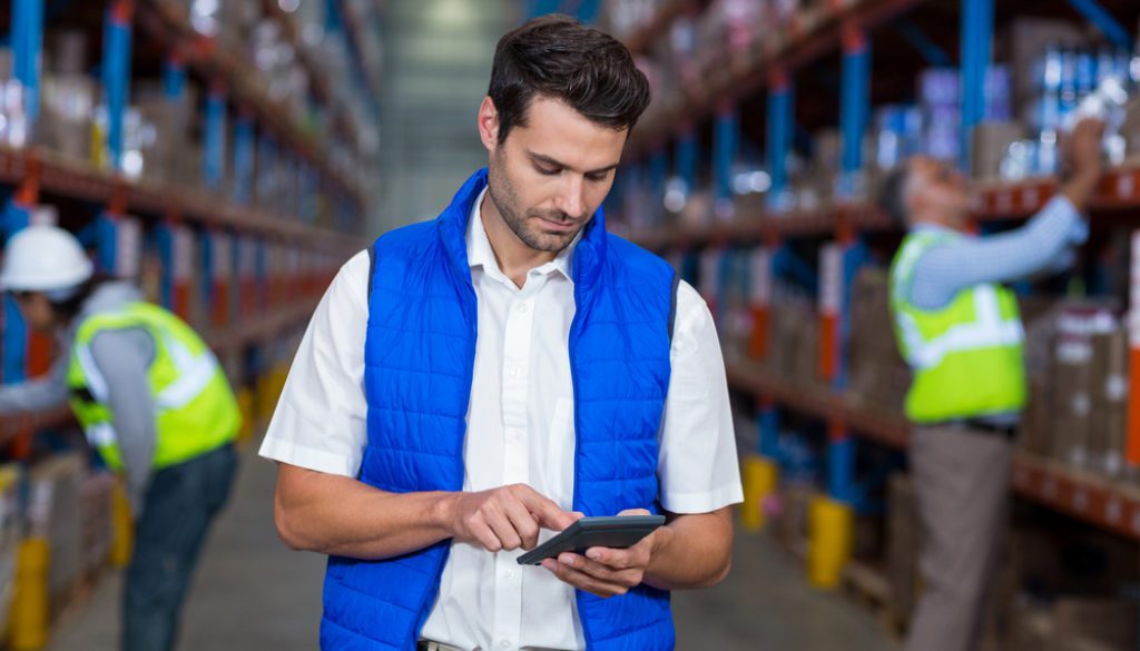 Worker,Looking,At,Camera,In,Warehouse