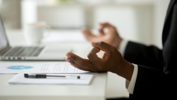 health and wellness safety plan employee meditate at desk