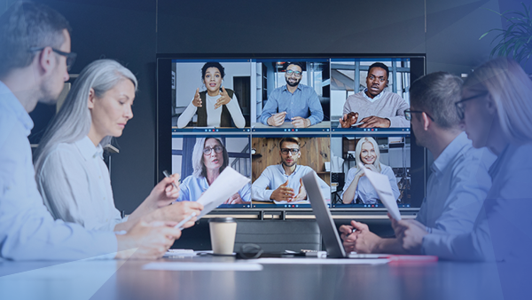 protecting employees office meeting with employees virtually joining on tv
