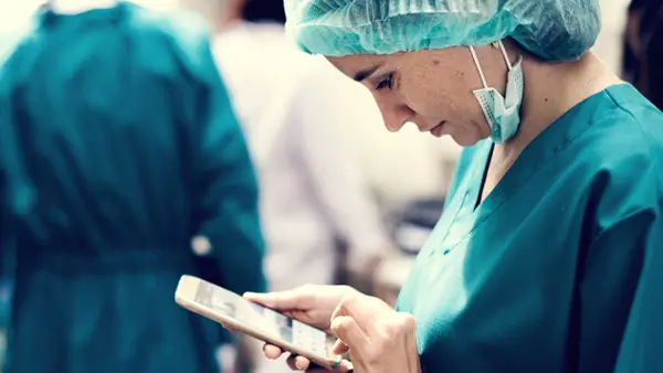 nurse looking at phone