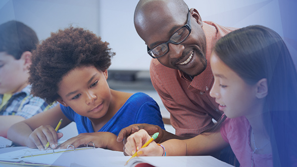 kids in a classroom learning from teacher