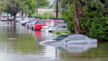 car submerged in floodwater