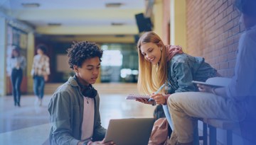 students in a hallways studying together