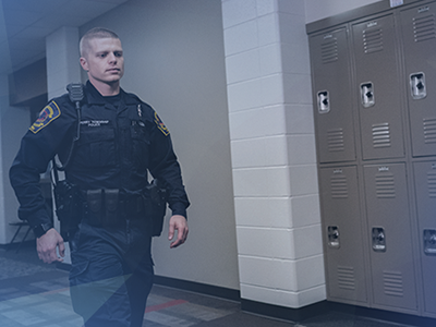 School safety officer walking hallway