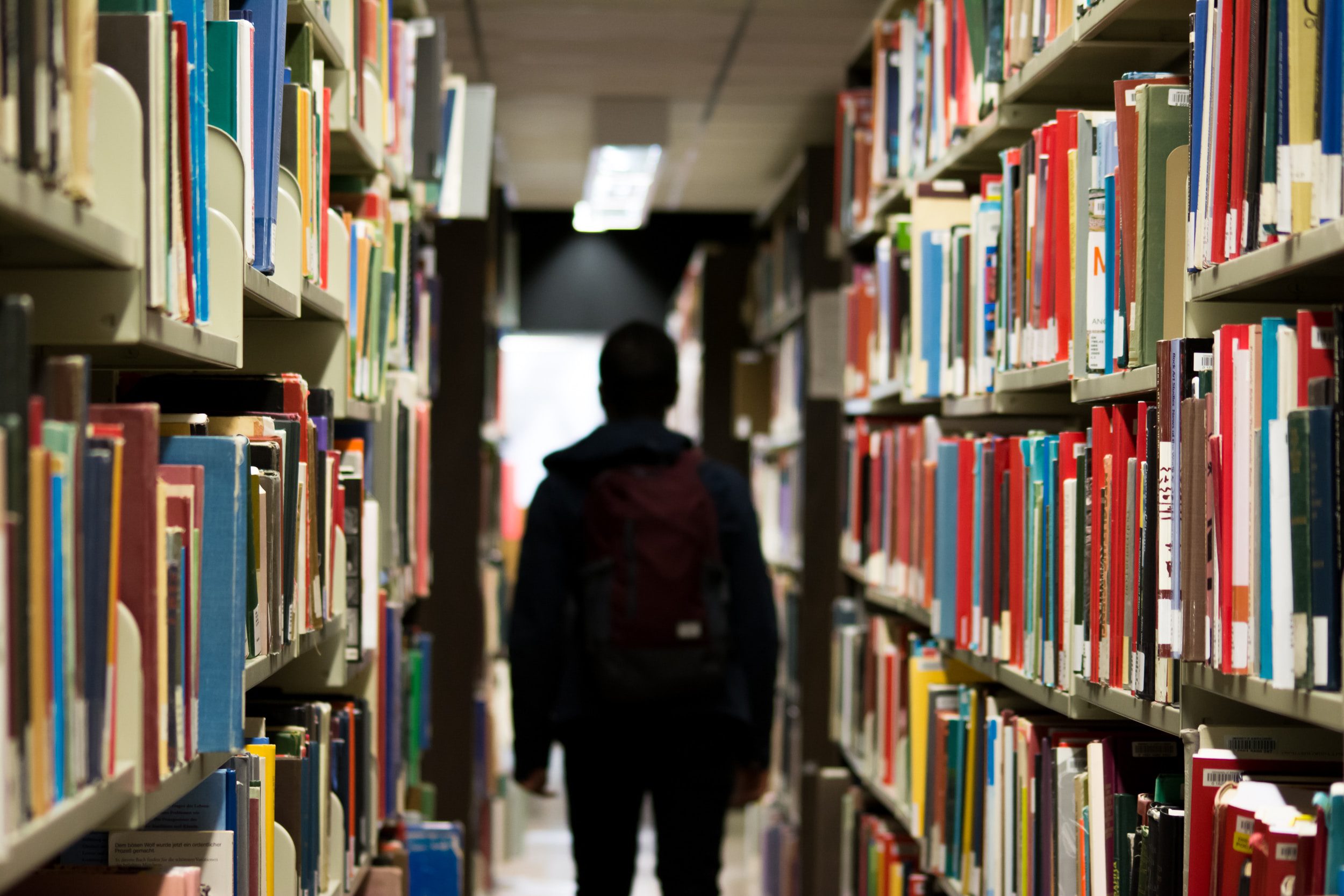 student-library-books student in library